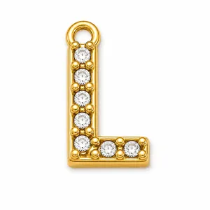 Close-up of a gold-plated letter L charm pavé-set with clear cubic zirconia stones