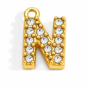 Close-up of gold-plated stainless steel letter N pendant with full rhinestone inlay