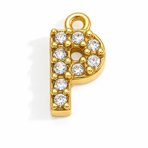 Macro view of gold-plated stainless steel letter P pendant encrusted with sparkling crystals