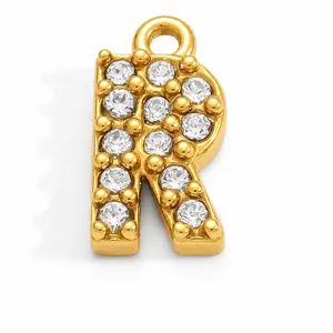 Detailed view of a gold-plated stainless steel letter R charm with clear rhinestones