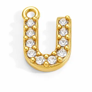 Detailed view of gold-plated stainless steel letter U pendant with sparkling crystals