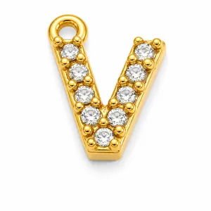Close-up of gold-plated stainless steel letter V pendant with cubic zirconia.