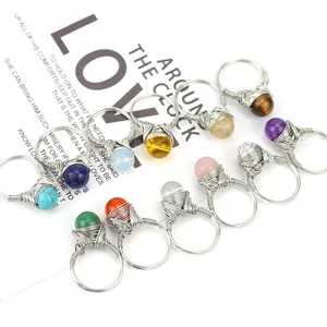 Detailed view of handmade wire wrapped rings with various natural stone beads