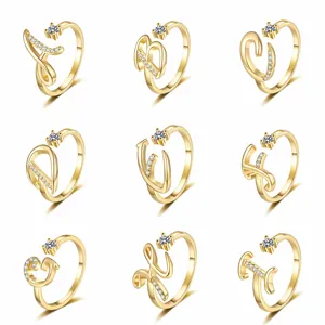 Detailed grid view of gold plated initial rings A-I with sparkling cubic zirconia accents