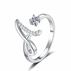 Macro view of adjustable silver ring featuring pave-set zircons in a letter A design