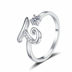 Detailed view of a silver open ring featuring an initial K and sparkling cubic zirconia.