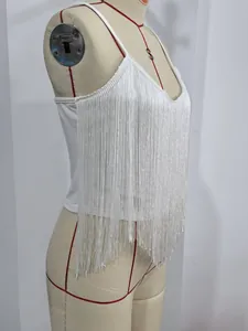 Detailed side view of a sexy white camisole top with long fringe on a dress form