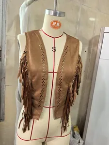 Detailed view of western style brown faux suede fringed vest with cutout patterns