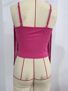 Detailed back view of a vibrant pink camisole with decorative side fringe on a mannequin