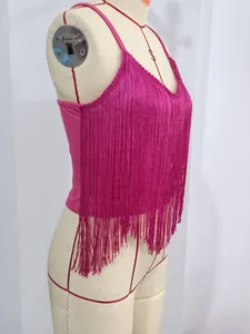 Side view of a vibrant fuchsia camisole featuring long, dense and flowing fringe details.
