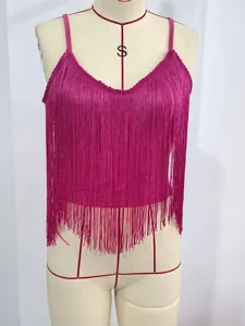 Close-up detail of a vibrant fuchsia fringe camisole top featuring dense tassel texture