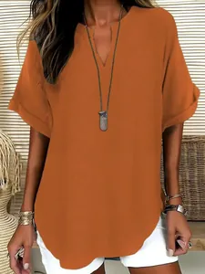 Detail view of the rust orange V-neck t-shirt showing its breathable linen texture