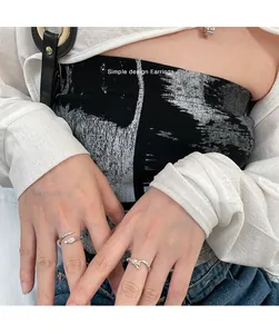 Close-up of vintage snake-shaped adjustable silver ring worn on a model's finger