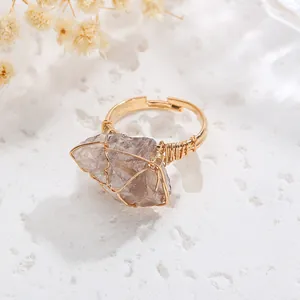 Close-up of handmade wire-wrapped ring with large irregular natural smoky quartz stone