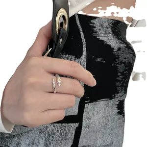 Vintage silver snake-shaped adjustable open ring shown on a model's index finger