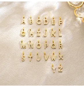 Detailed view of 26 sterling silver alphabet pendants with full pavé zirconia stones