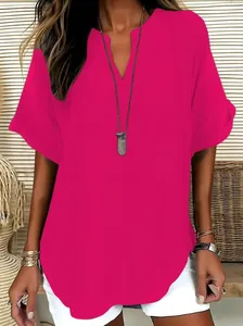 Close-up detail of a vibrant magenta women's V-neck short sleeve T-shirt blouse