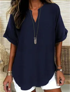 Detail view of a navy blue V-neck short sleeve shirt with natural linen texture
