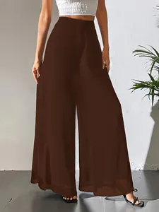 Pantalon large élégant en mousseline marron avec taille haute et coupe fluide.