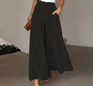 Detail of high-waisted black wide-leg pants with comfortable elastic waistband