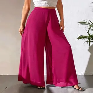 Vue complète d'un pantalon large en mousseline magenta vif avec une coupe ample