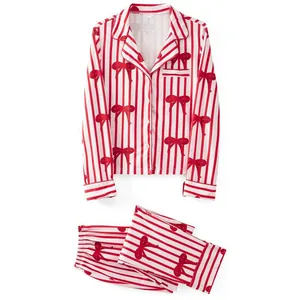 Pijama de Navidad de dos piezas a rayas rojas y blancas con estampados de lazos