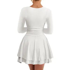 Detailed back view of an elegant white long sleeve dress with a pleated flared hem