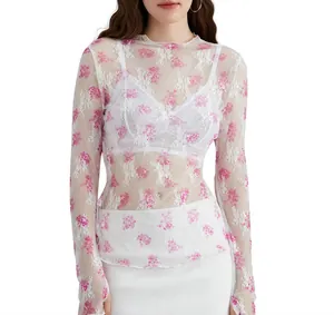 Close-up detail of white floral sheer lace mesh long sleeve top for women fashion
