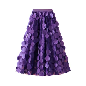 Detailed view of a purple A-line mesh skirt featuring intricate 3D circular flower appliqués