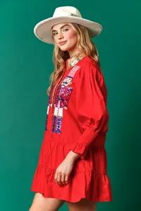 Festive red Christmas mini dress featuring sequined nutcracker and elegant puff sleeves