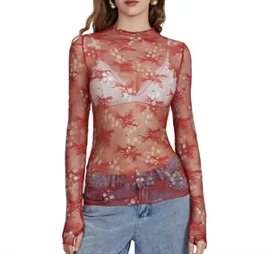 Close-up view of red sheer lace top with intricate floral mesh embroidery details