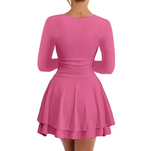 Detailed back view of pink long sleeve party dress with tiered ruffled hemline
