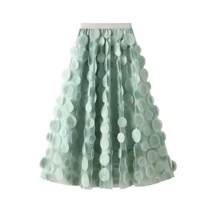Detail showing 3D circular floral embellishments on a mint green mesh A-line skirt