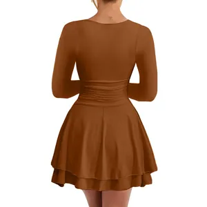 Back view of elegant brown long sleeve pleated waist dress with ruffled layered skirt