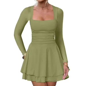 Detailed view of sage green square neck dress with pleated waist and layered skirt