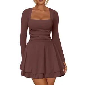 Detail view of square neck long sleeve dress with pleated waist and layered hem