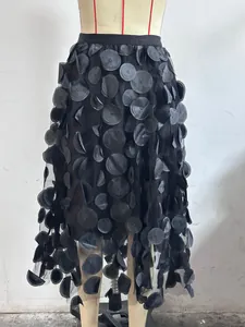 Detailed view of high-waist black 3D floral mesh A-line skirt with textured appliques