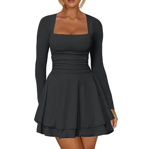 Detailed view of the square neck and ruched tiered hem on this elegant black party mini dress