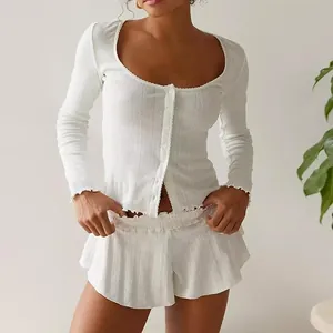 Detailed view of a white French-style casual set with lettuce edge ruffles on a model