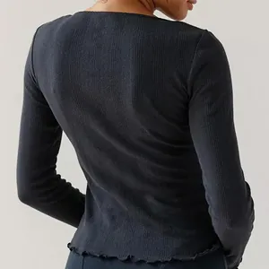 Close-up of back view showing ribbed fabric and lettuce edge hem details