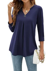 Elegant navy blue 3/4 sleeve V-neck blouse with pleat detail and metal ring accent