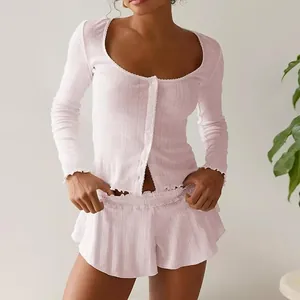 Chic light pink French-style lounge set featuring pointelle knit with ruffle hem detail