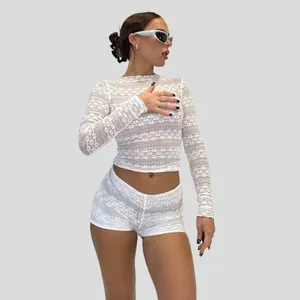 Stylish white sheer lace long sleeve crop top and matching tight shorts set for women