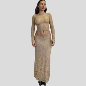 Elegant sheer lace two-piece set featuring long sleeve crop top and matching maxi skirt