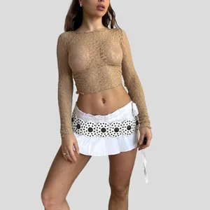 Detailed view of women's sheer lace long sleeve top with mesh texture