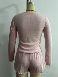 Detailed back view of pink French style lounge set featuring lettuce trim on shorts and top