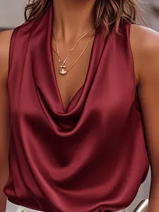 Detail of burgundy satin sleeveless blouse with elegant cowl neckline draped texture