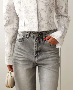 Detail view of a short cropped blazer with elegant lavender ink floral print texture.