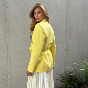 Chic yellow blazer with 3D flower detail and waist tie, side view of feminine fit