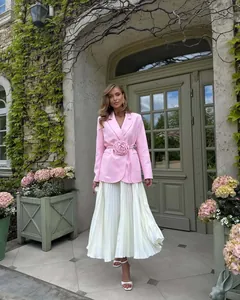 Elegant pink blazer with a large 3D flower decoration and a cinched waist detail